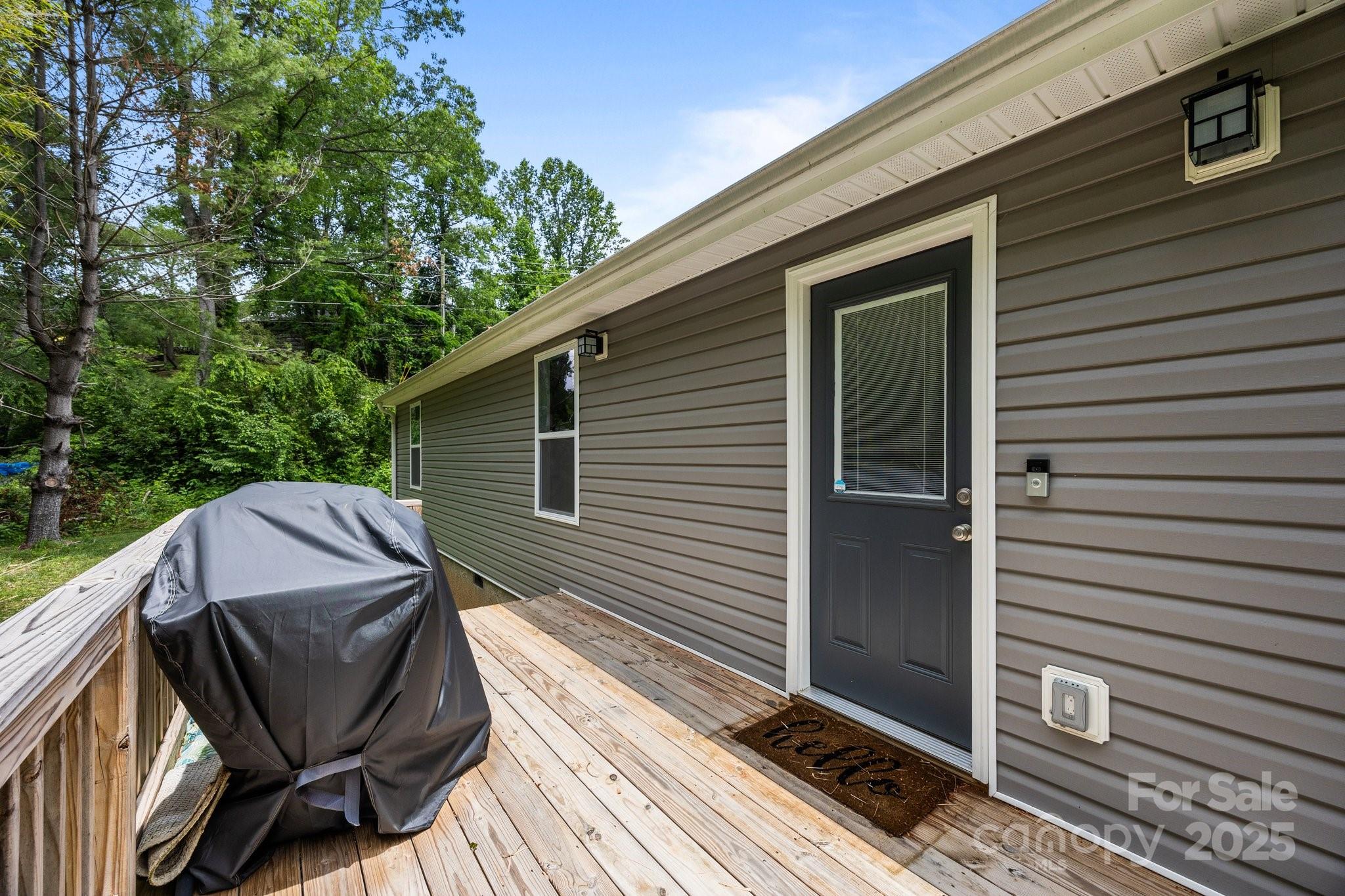458 Summer Road Hendersonville, NC 28792 - Photo 28 of 29 a view of a backyard with sitting area