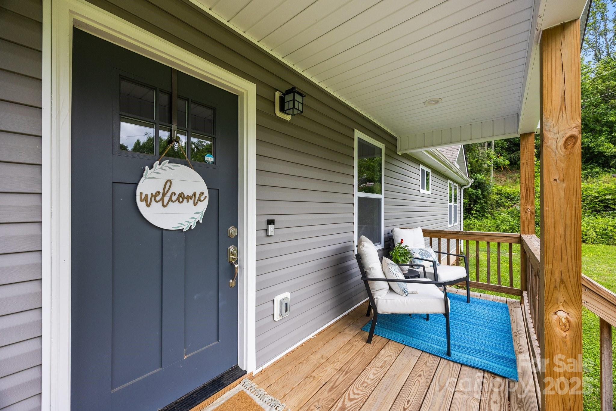 458 Summer Road Hendersonville, NC 28792 - Photo 4 of 29 a view of a deck with furniture
