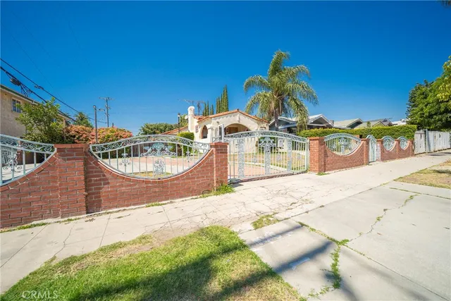 a backyard of a house with yard and outdoor seating
