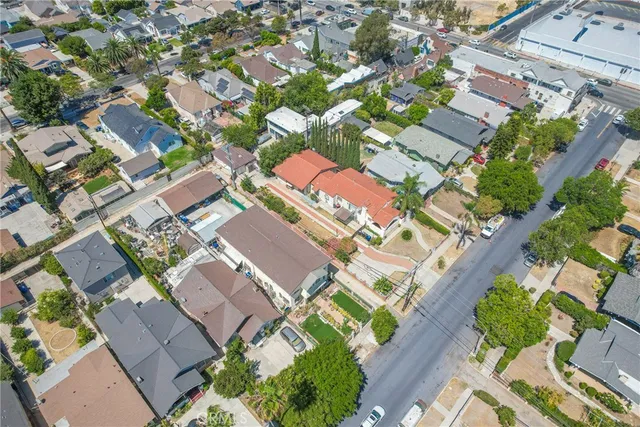 an aerial view of a residential apartment building with a yard