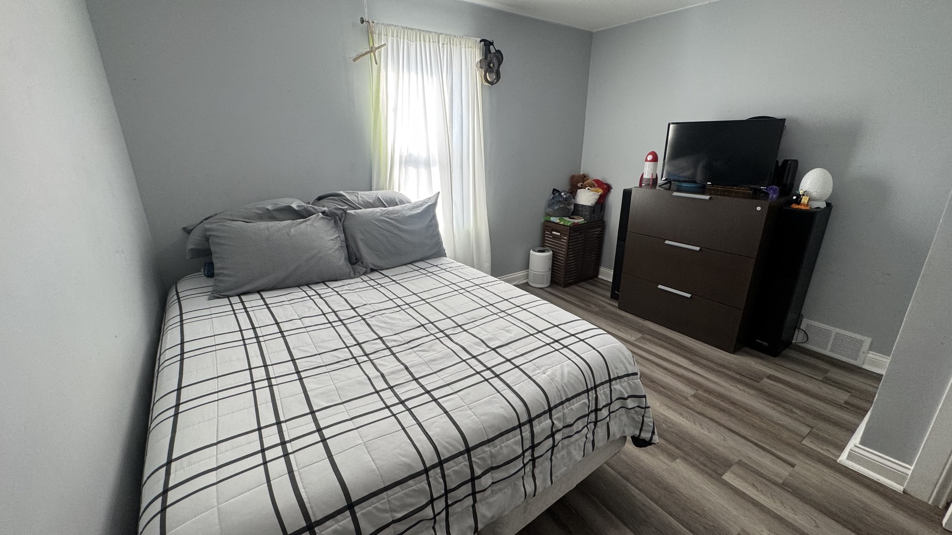7700 West 83rd Street Bridgeview, IL 60455 - Photo 18 of 37 a bedroom with a bed and wooden floor