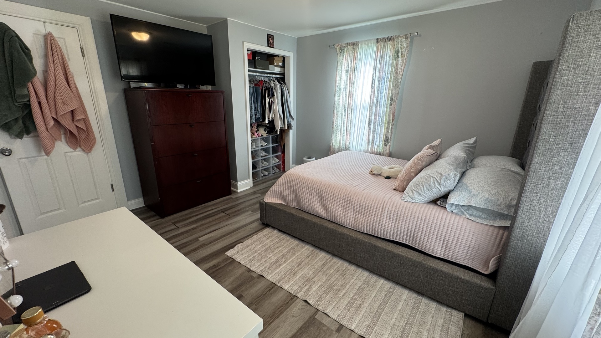 7700 West 83rd Street Bridgeview, IL 60455 - Photo 22 of 37 a bedroom with a bed window and a flat screen tv