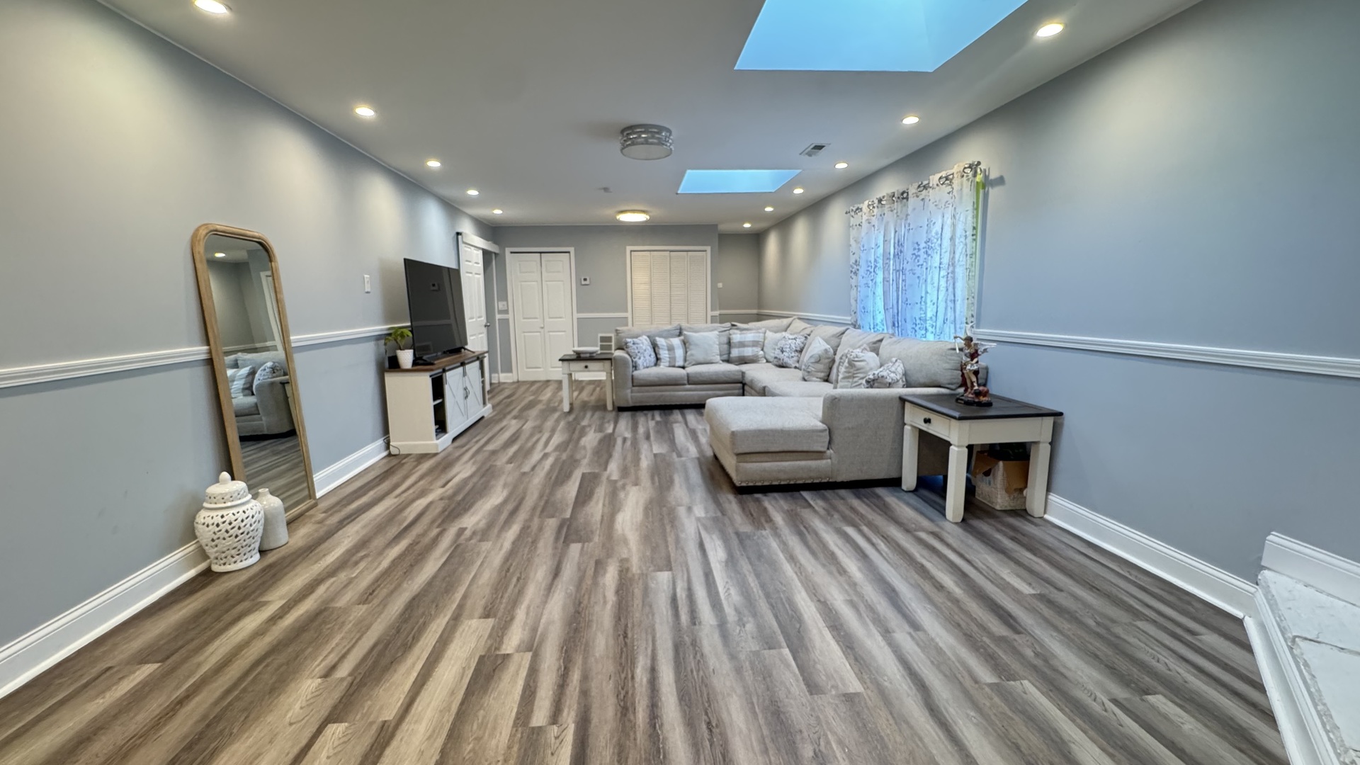 7700 West 83rd Street Bridgeview, IL 60455 - Photo 10 of 37 a living room with couches and kitchen view with wooden floor