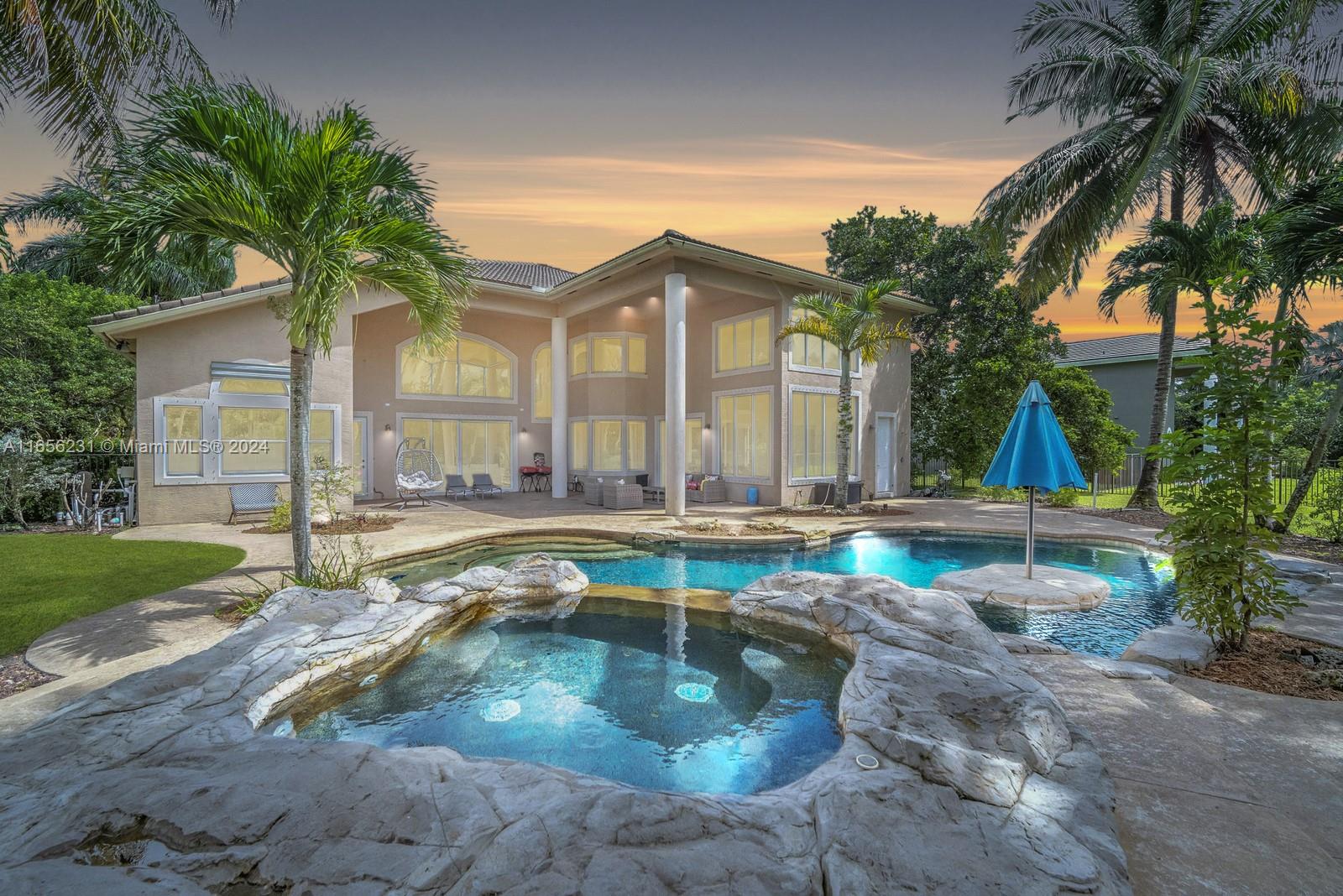 10278 Laurel Road Davie, FL 33328 - Photo 54 of 74 a view of a house with swimming pool and sitting area