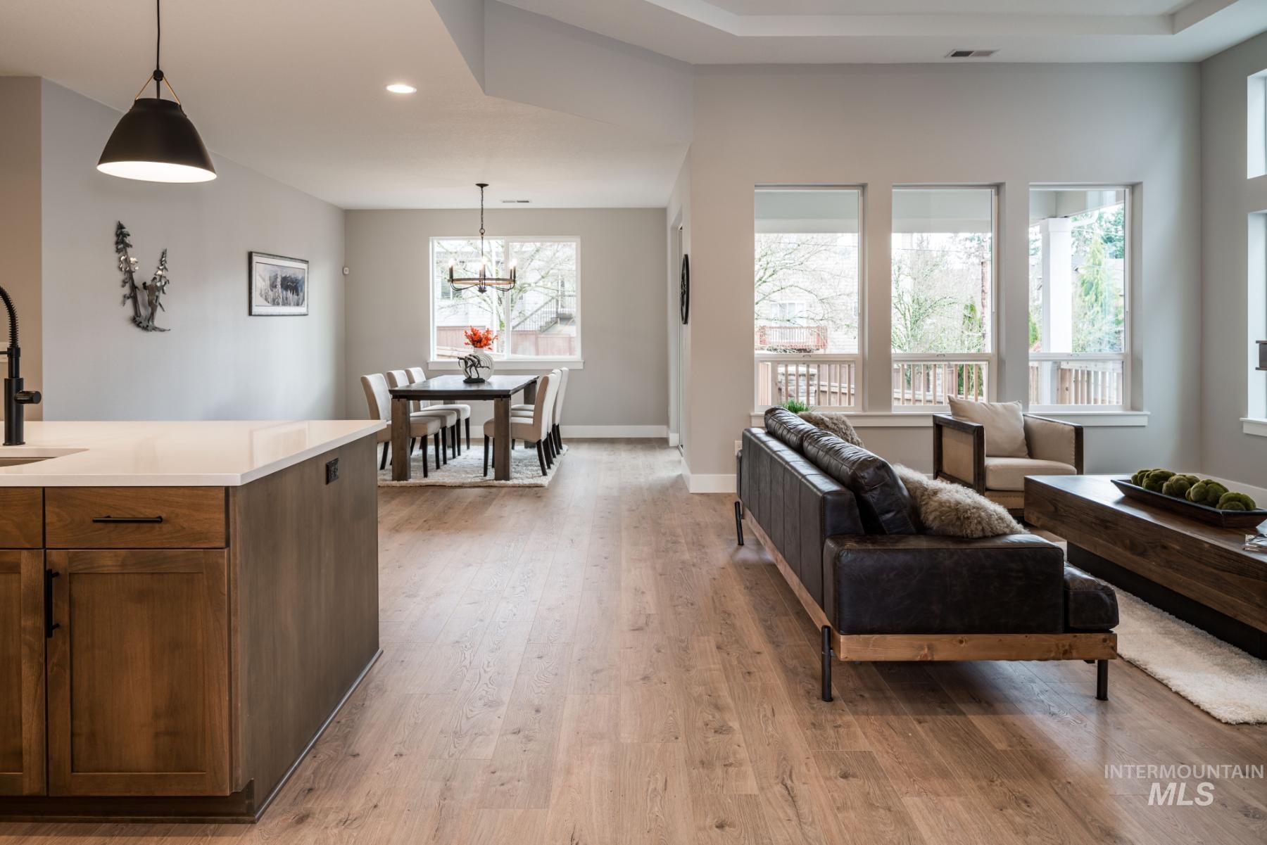 1279 West Malbar Street Meridian, ID 83646 - Photo 5 of 23 Living area featuring light wood finished floors, a chandelier, and recessed lighting