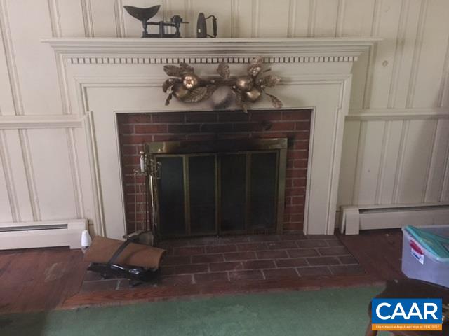 267 Courthouse Road Palmyra, VA 22963 - Photo 3 of 7 a living room with a fireplace
