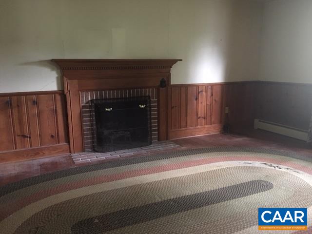 267 Courthouse Road Palmyra, VA 22963 - Photo 4 of 7 a living room with a fireplace