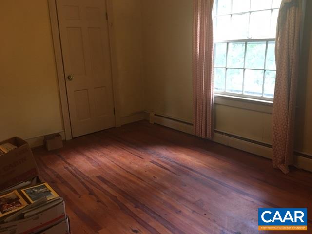 267 Courthouse Road Palmyra, VA 22963 - Photo 5 of 7 an empty room with wooden floor