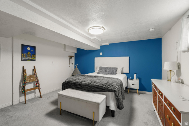 961 33rd Street Ogden, UT 84403 - Photo 23 of 39 Light gray carpeting and white walls with a blue accent wall