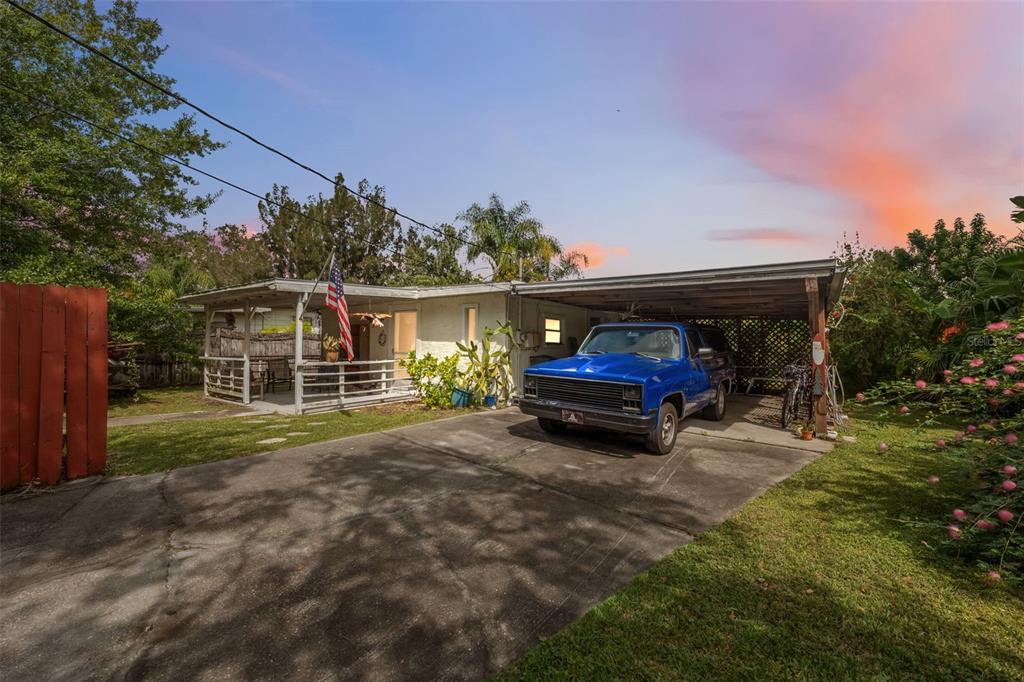 5853 Mariposa Drive Holiday, FL 34690 - Photo 1 of 1 a view of house with backyard space and balcony