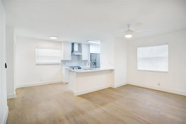 a view of a kitchen with empty racks