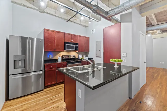 a kitchen that has a sink and a stove
