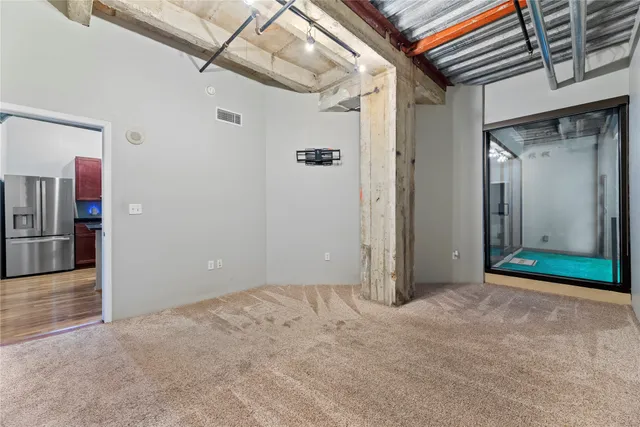 a bathroom with a granite countertop sink a large mirror and a shower