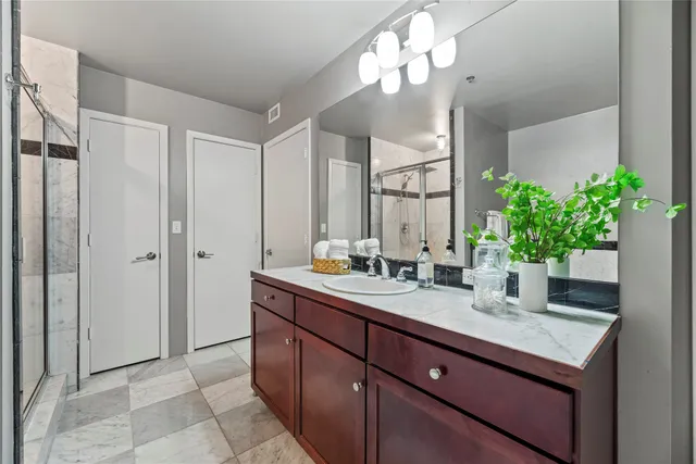 a bathroom with a tub and shower