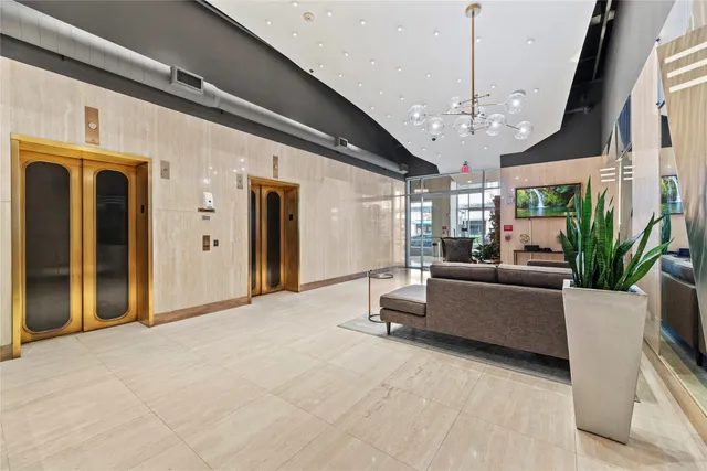 a hallway with beautiful frames and flower vase