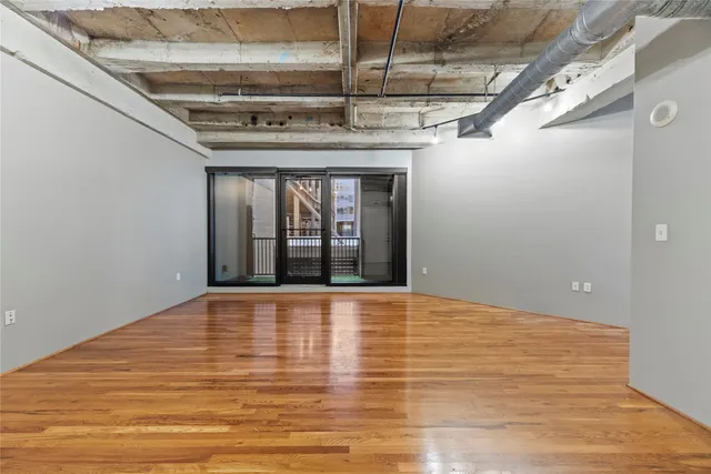 a kitchen with kitchen island granite countertop a sink appliances and cabinets