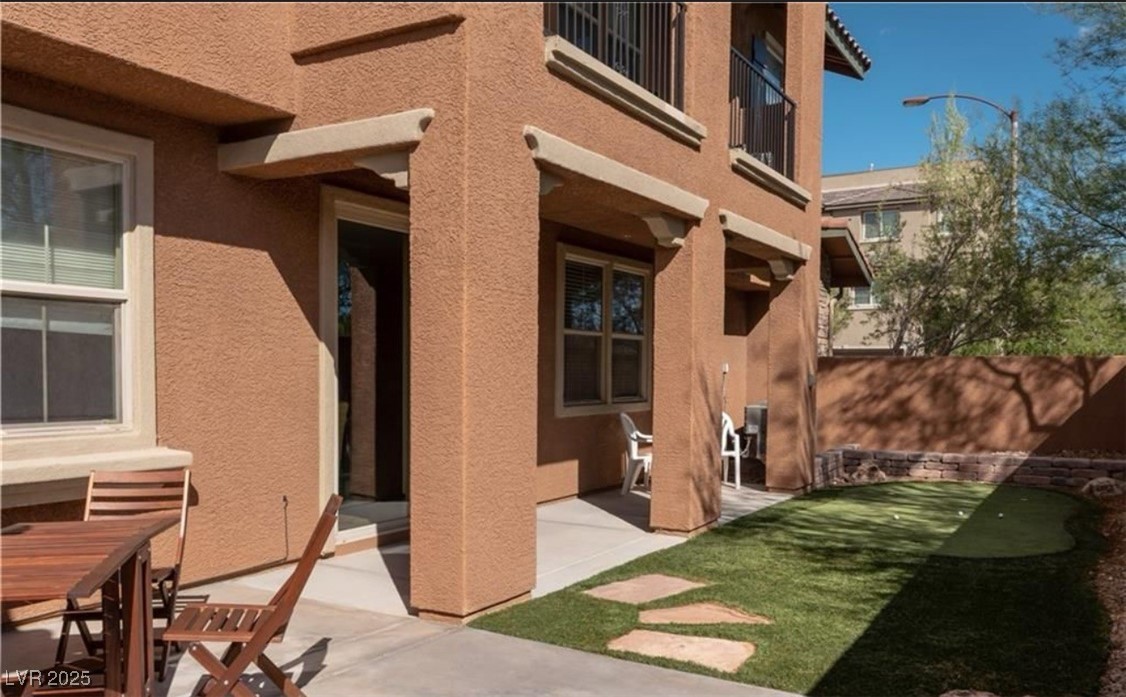 7215 Moonraker Avenue, Unit 111 Las Vegas, NV 89178 - Photo 4 of 5 Patio / terrace featuring a putting green and a patio