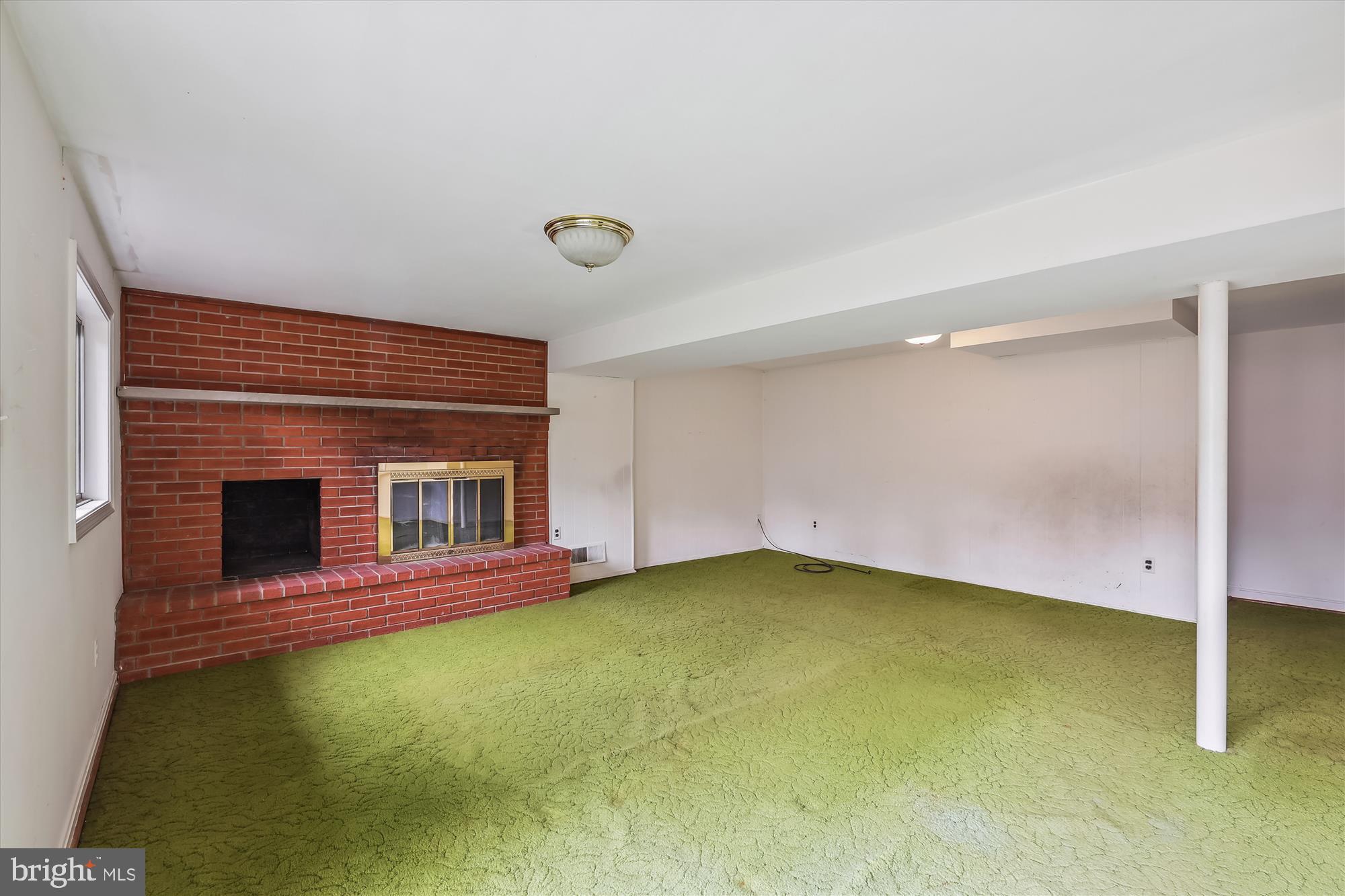 8621 Cromwell Drive Springfield, VA 22151 - Photo 23 of 41 Wood burning fireplace in the lower level rec room