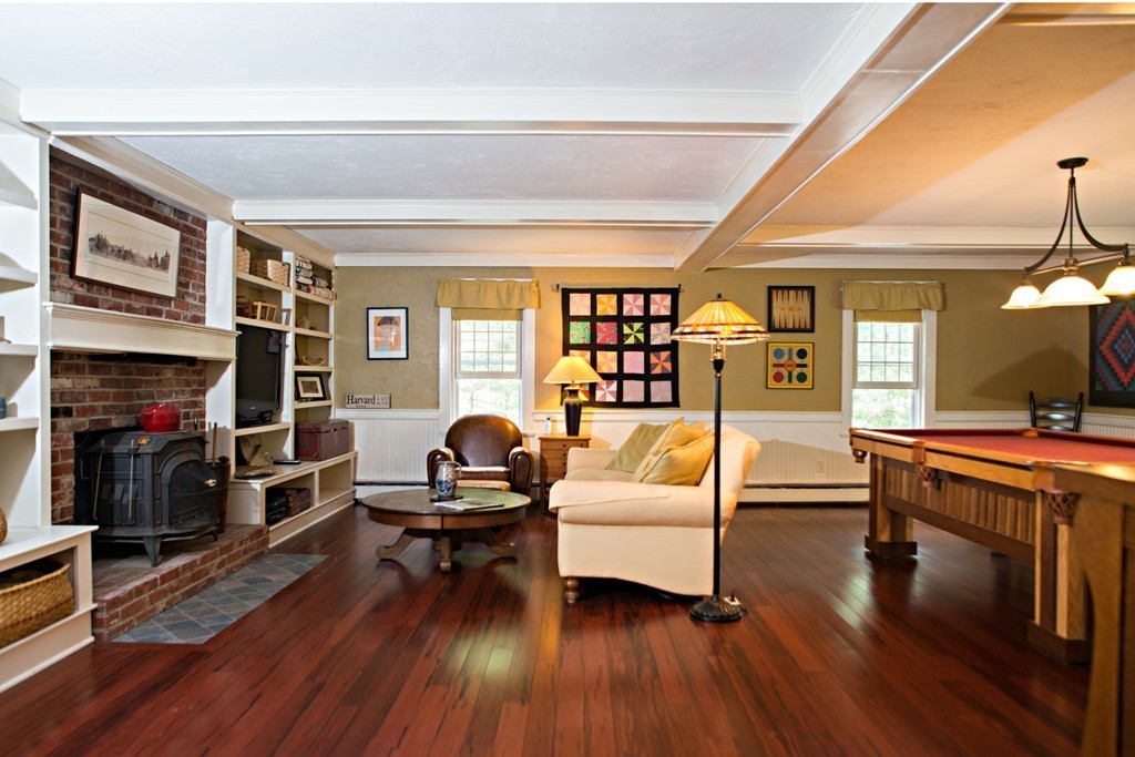 225 Littleton County Road Harvard, MA 01451 - Photo 3 of 30 a living room with furniture and a fireplace