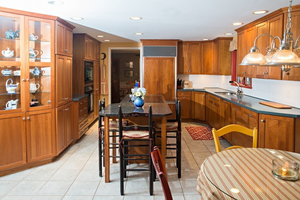 225 Littleton County Road Harvard, MA 01451 - Photo 4 of 30 a view of a kitchen dining table and chairs