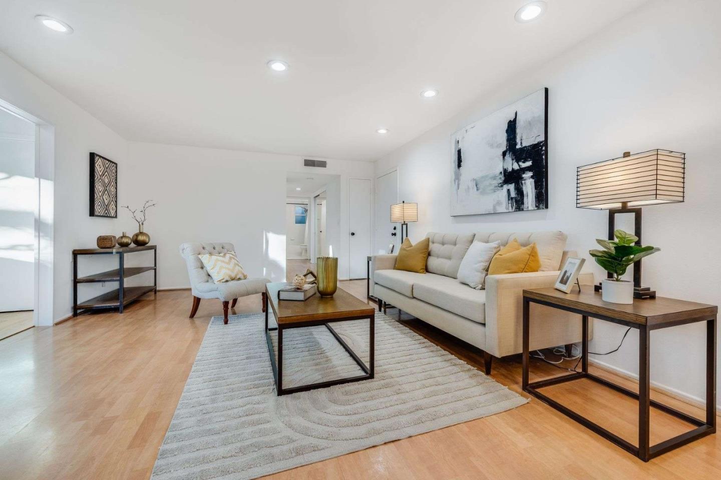a living room with furniture and a lamp