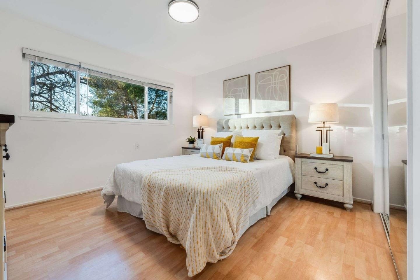 14225 Lora Drive, Unit 59 Los Gatos, CA 95032 - Photo 12 of 20 a bed room with a bed and a night stand