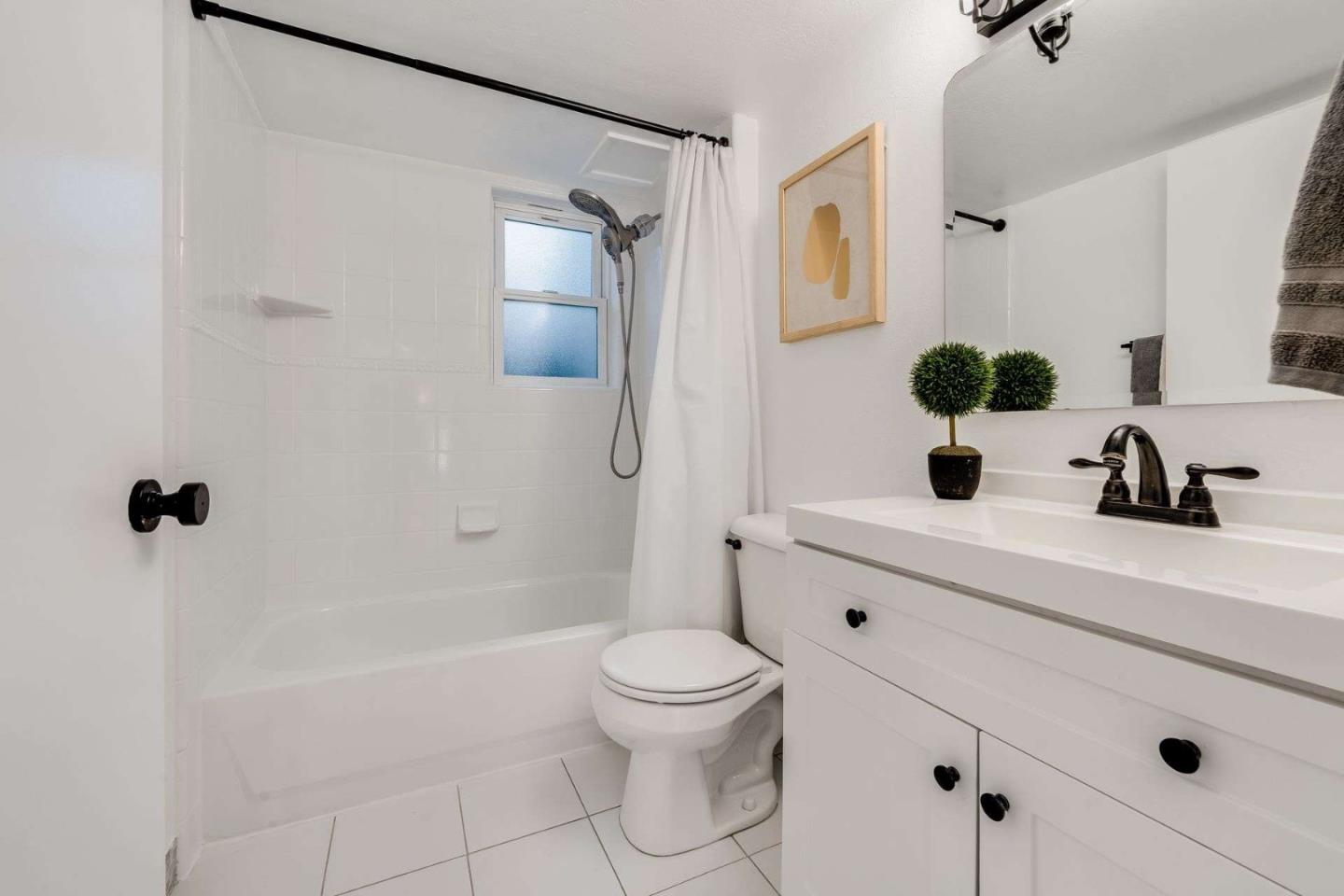 14225 Lora Drive, Unit 59 Los Gatos, CA 95032 - Photo 14 of 20 a bathroom with a sink a toilet and shower