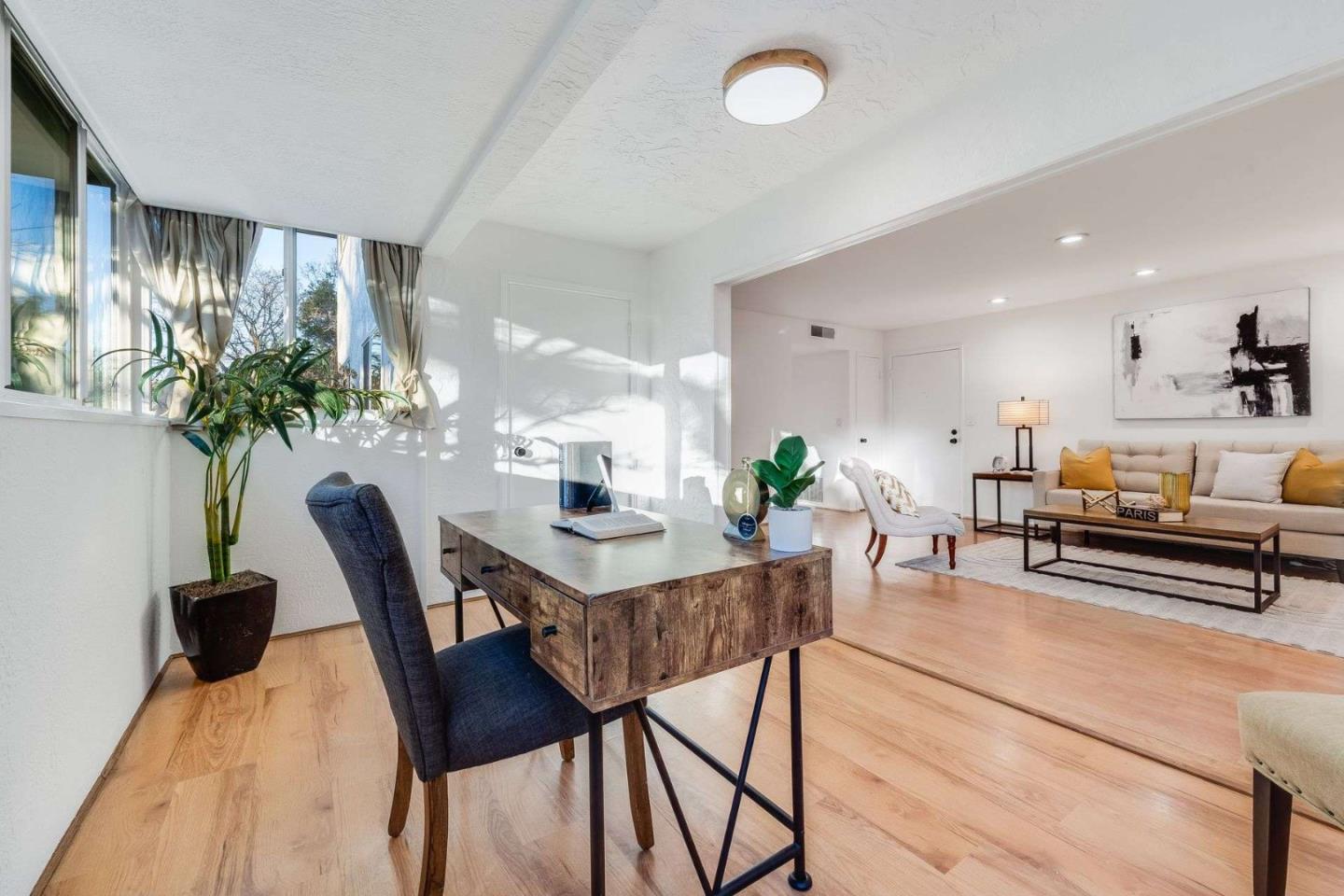 14225 Lora Drive, Unit 59 Los Gatos, CA 95032 - Photo 5 of 20 a view of a dining room with furniture and wooden floor
