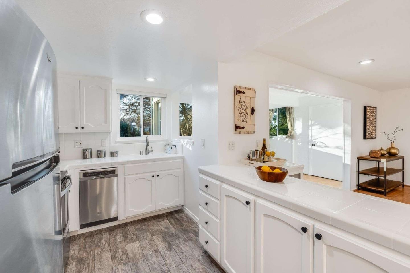 14225 Lora Drive, Unit 59 Los Gatos, CA 95032 - Photo 7 of 20 a spacious bathroom with stainless steel appliances a sink and a double vanity sink