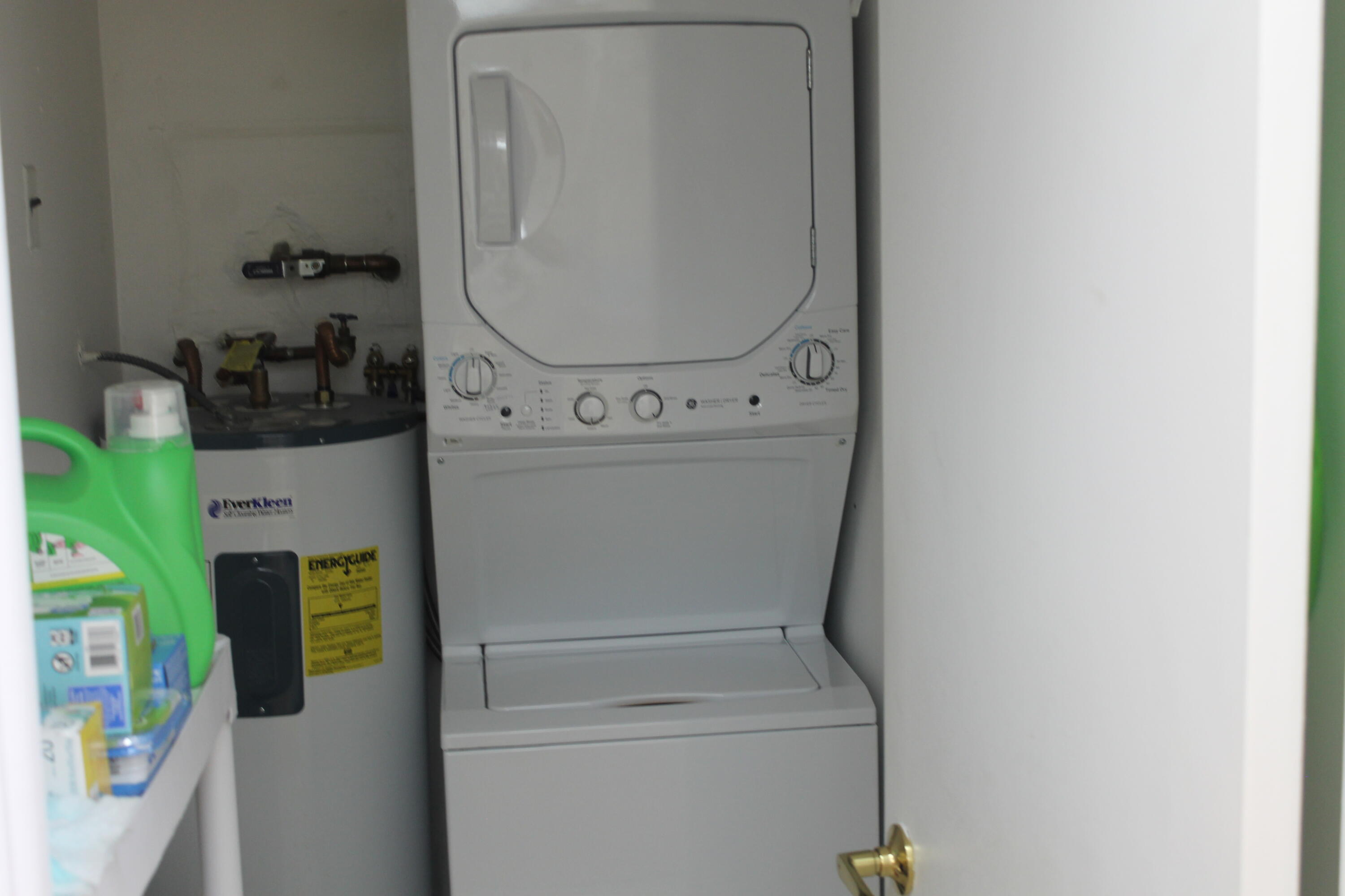 6461 Northwest 2nd Avenue, Unit 102 Boca Raton, FL 33487 - Photo 19 of 30 a utility room with dryer and washer