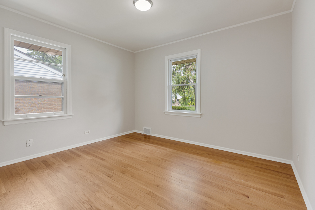 1528 Herbert Avenue Berkeley, IL 60163 - Photo 12 of 25 an empty room with a window