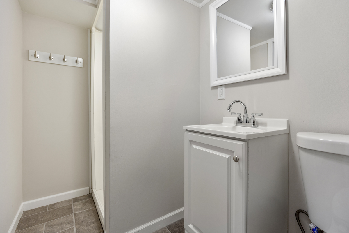 1528 Herbert Avenue Berkeley, IL 60163 - Photo 22 of 25 a bathroom with a sink and a mirror