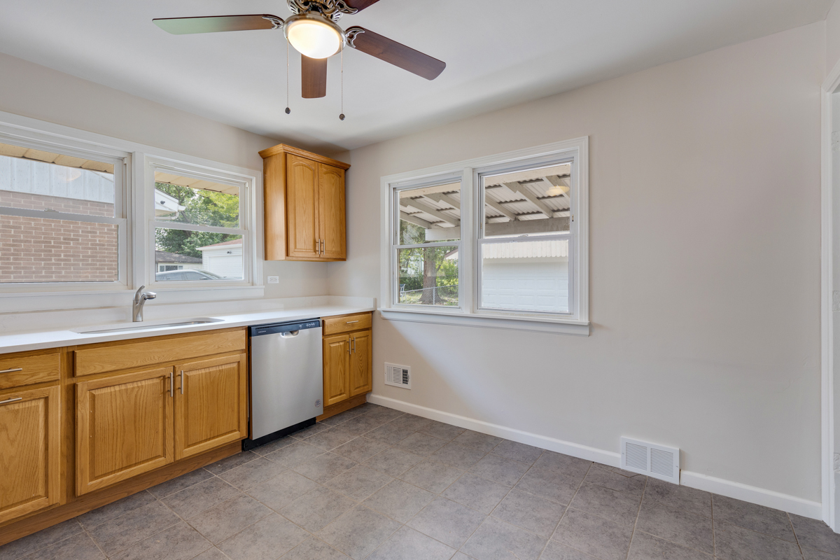 1528 Herbert Avenue Berkeley, IL 60163 - Photo 7 of 25 a kitchen with a window and a sink