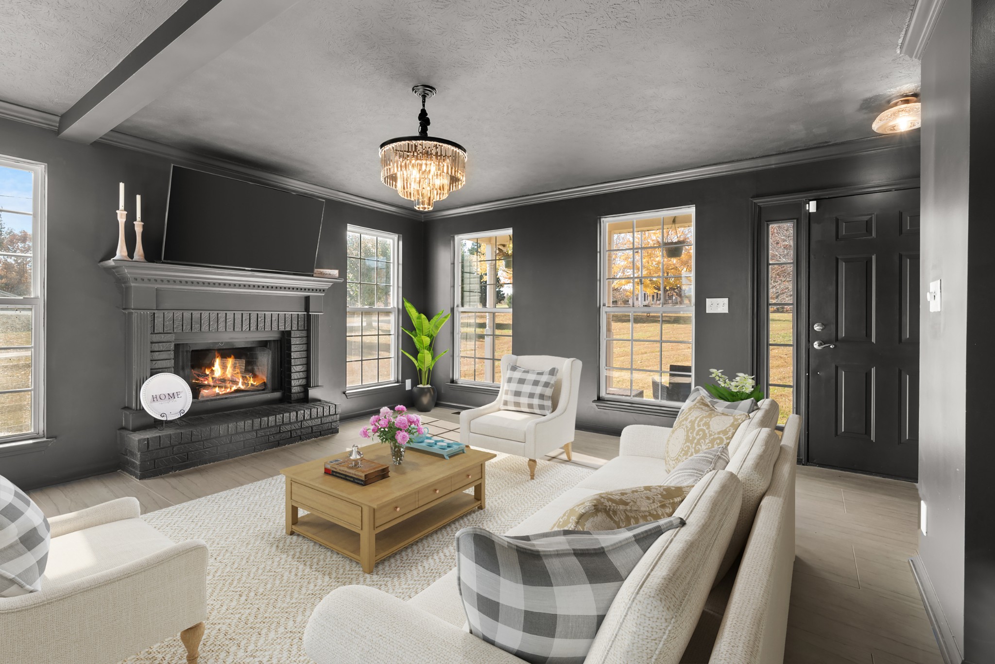 2867 Jack Teasley Road Pleasant View, TN 37146 - Photo 11 of 61 a living room with furniture a fireplace and a large window