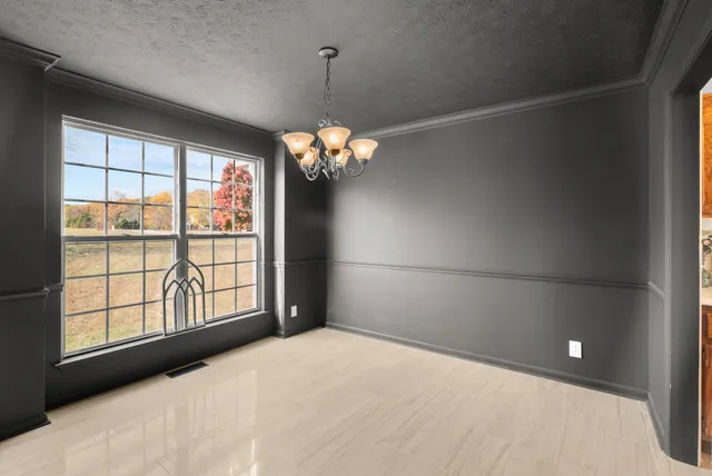 a kitchen with stainless steel appliances granite countertop a refrigerator sink and stove