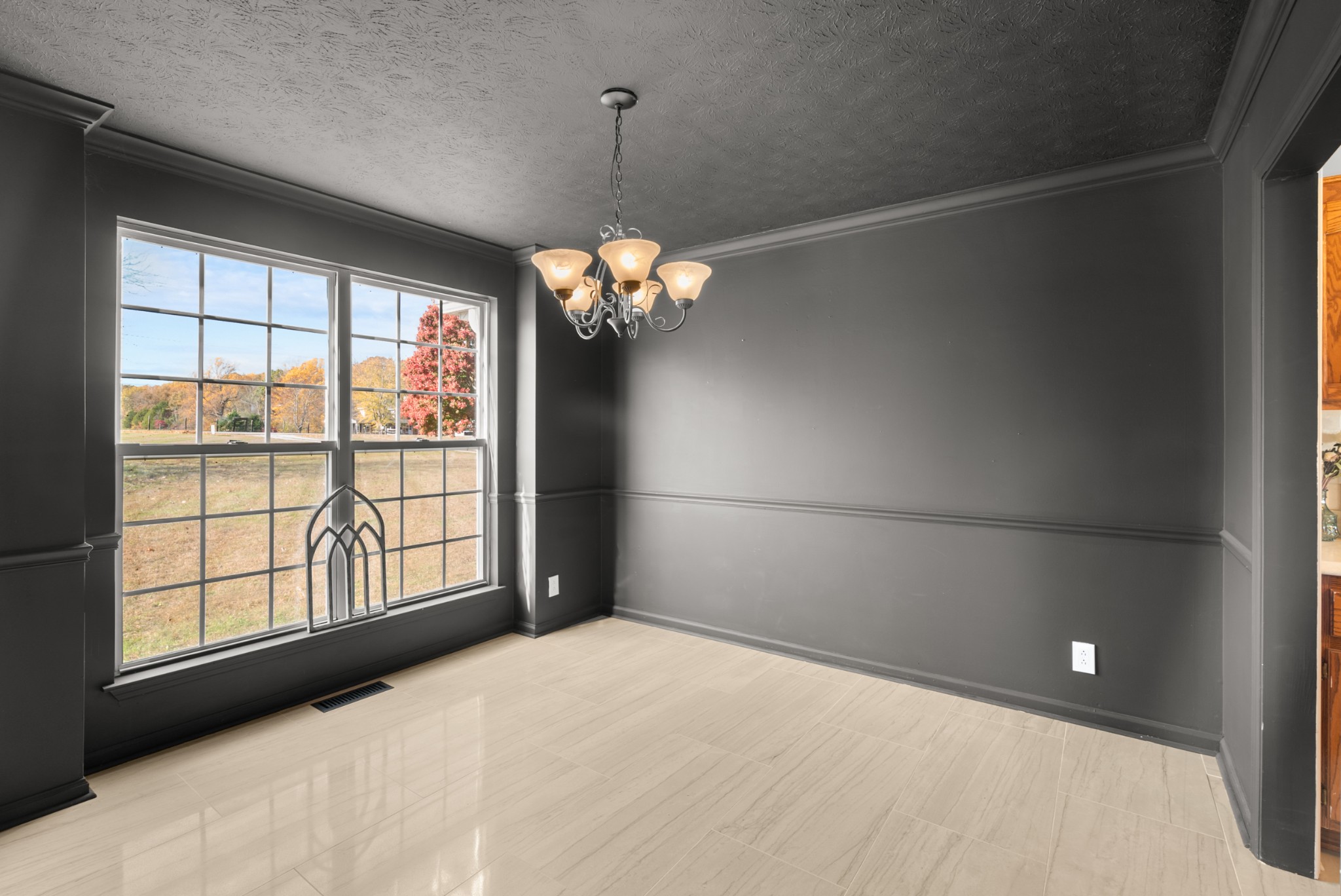 2867 Jack Teasley Road Pleasant View, TN 37146 - Photo 16 of 61 a view of a livingroom with a chandelier fan and a large window