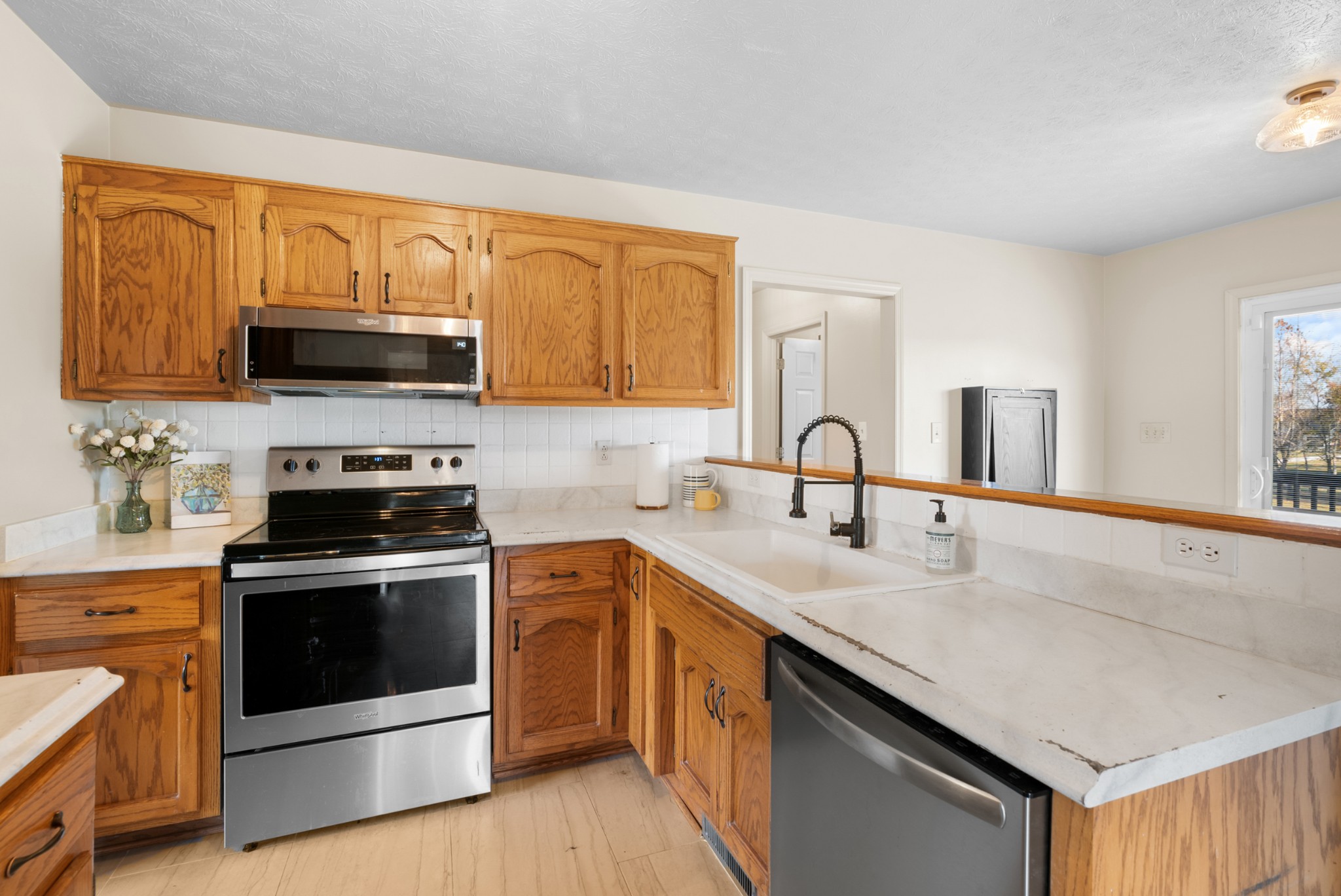 2867 Jack Teasley Road Pleasant View, TN 37146 - Photo 18 of 61 a kitchen with sink a microwave and stove