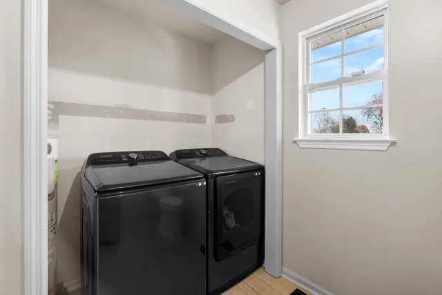 a en suite bathroom with a sink double vanity and a mirror