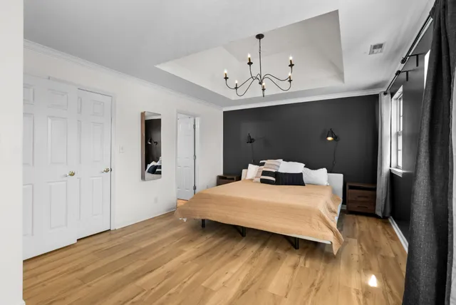 a view of empty room with a window and ceiling fan