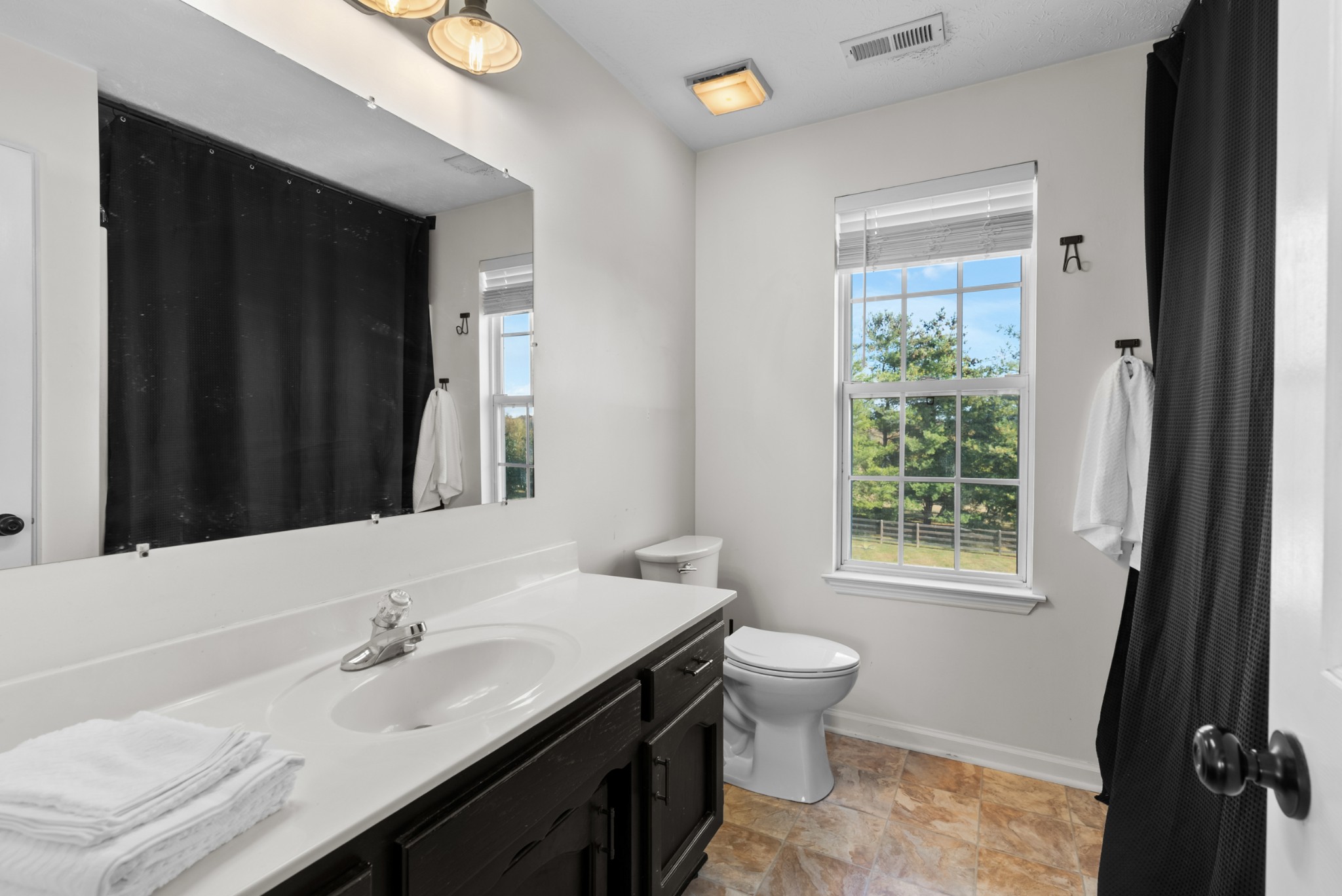 2867 Jack Teasley Road Pleasant View, TN 37146 - Photo 33 of 61 a bathroom with a sink and a mirror