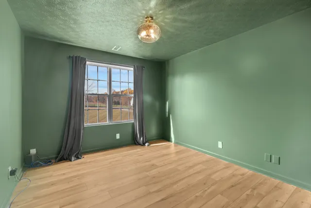 a view of a livingroom with wooden floor