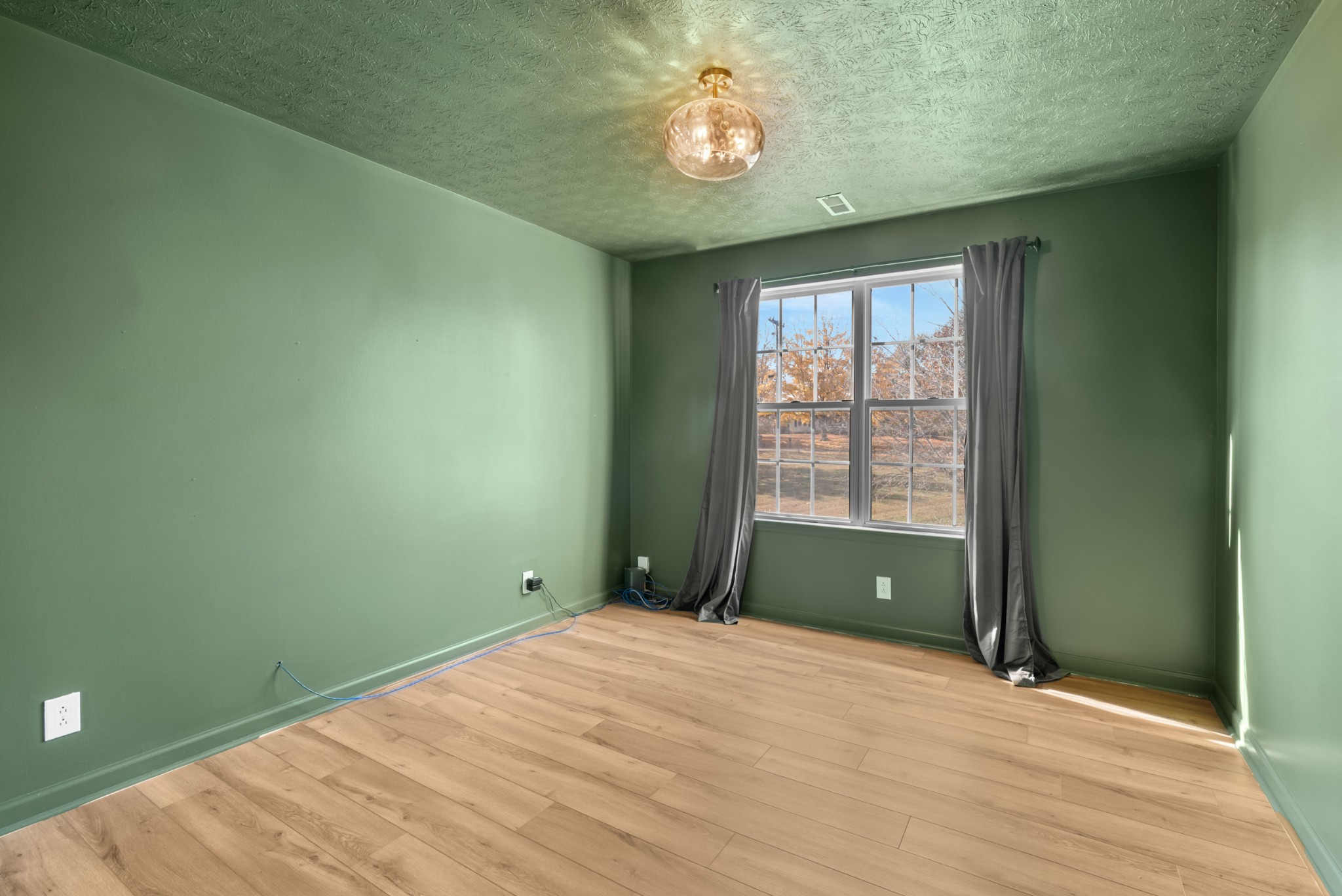 2867 Jack Teasley Road Pleasant View, TN 37146 - Photo 36 of 61 a view of empty room with a window and ceiling fan
