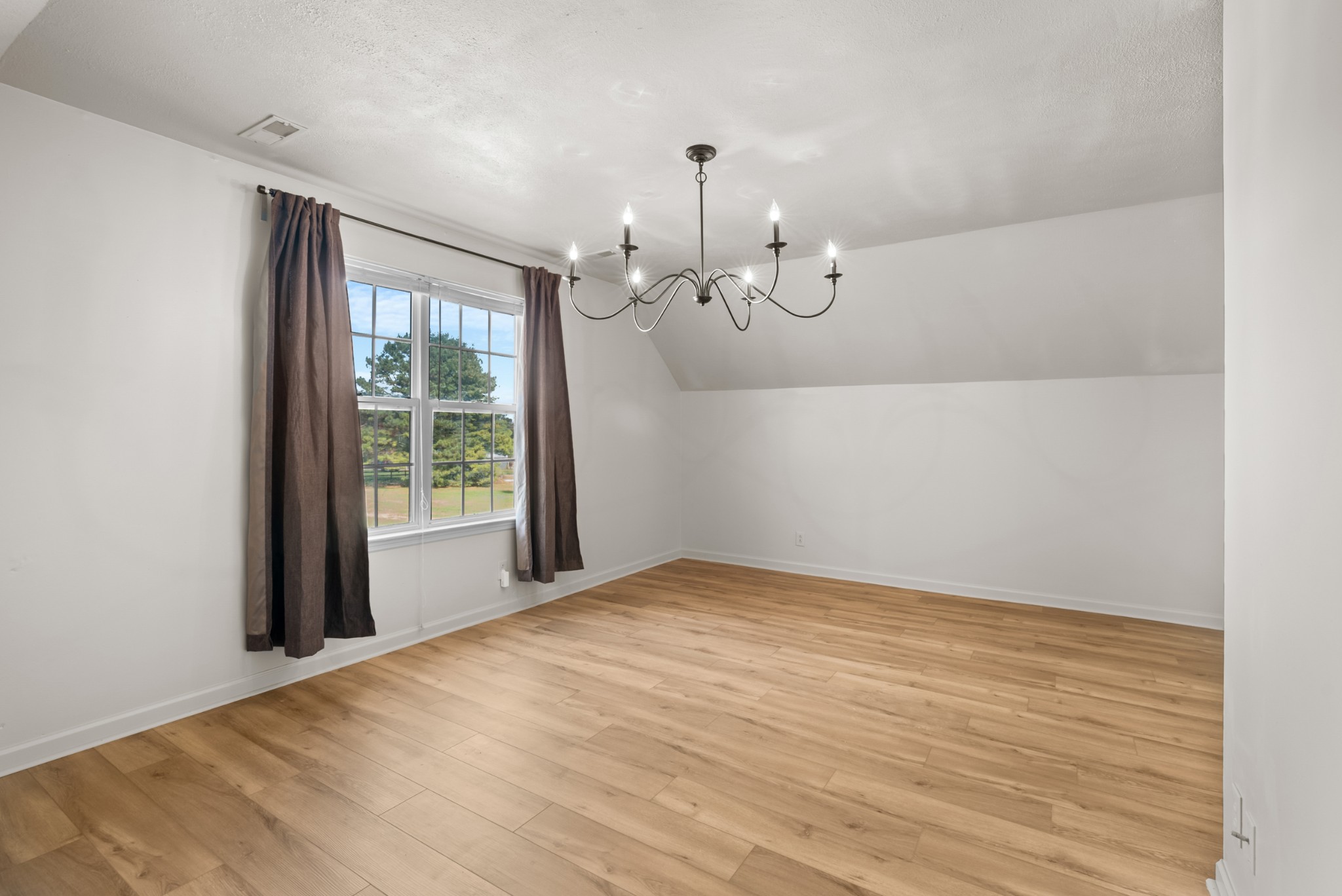 2867 Jack Teasley Road Pleasant View, TN 37146 - Photo 44 of 61 a view of a room with wooden floor and windows