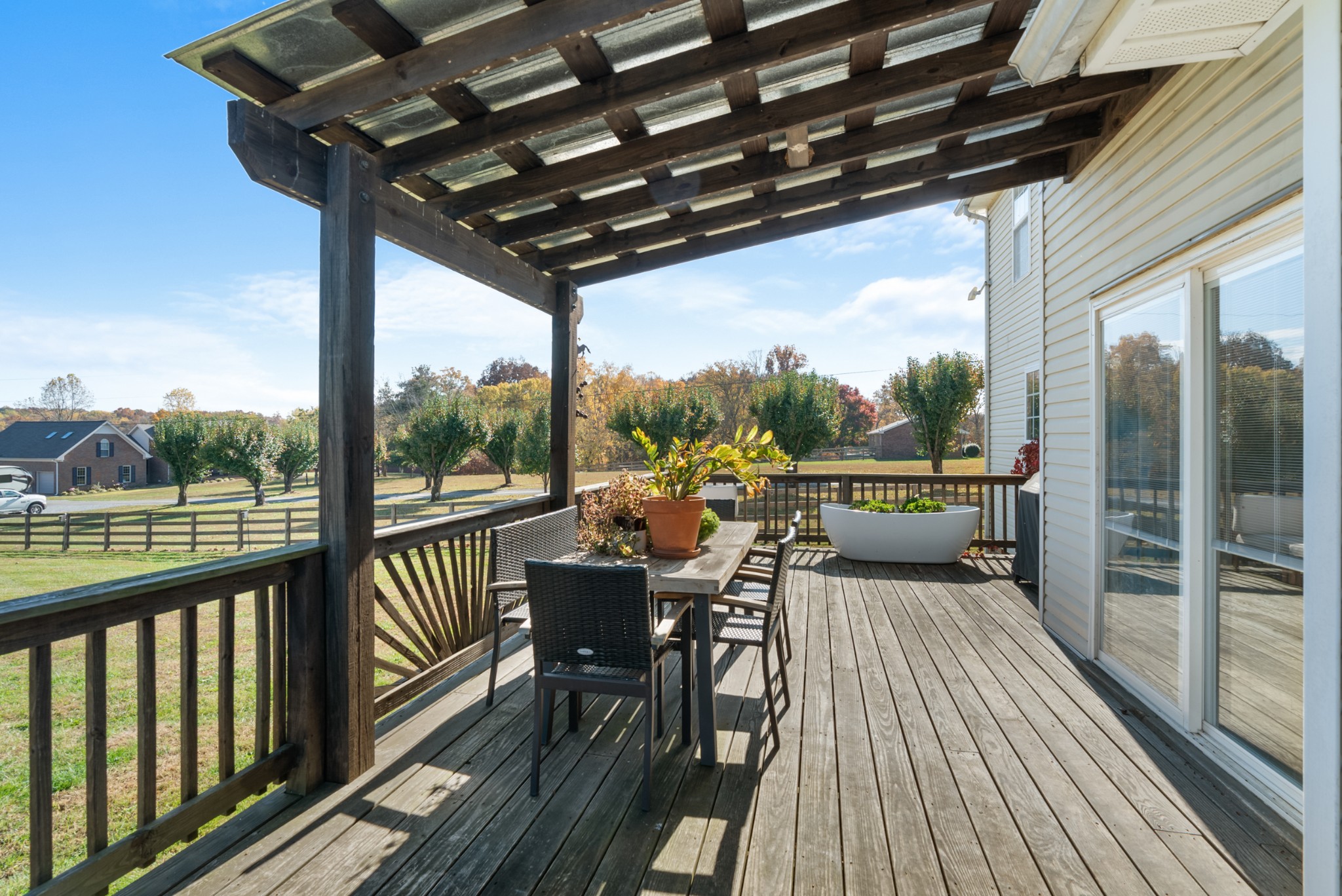 2867 Jack Teasley Road Pleasant View, TN 37146 - Photo 47 of 61 a view of a balcony with chairs and wooden floor