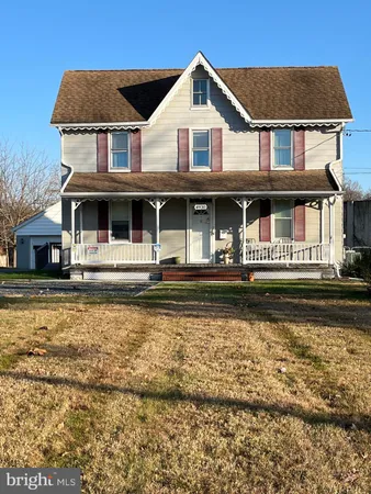 a front view of a house with swimming pool