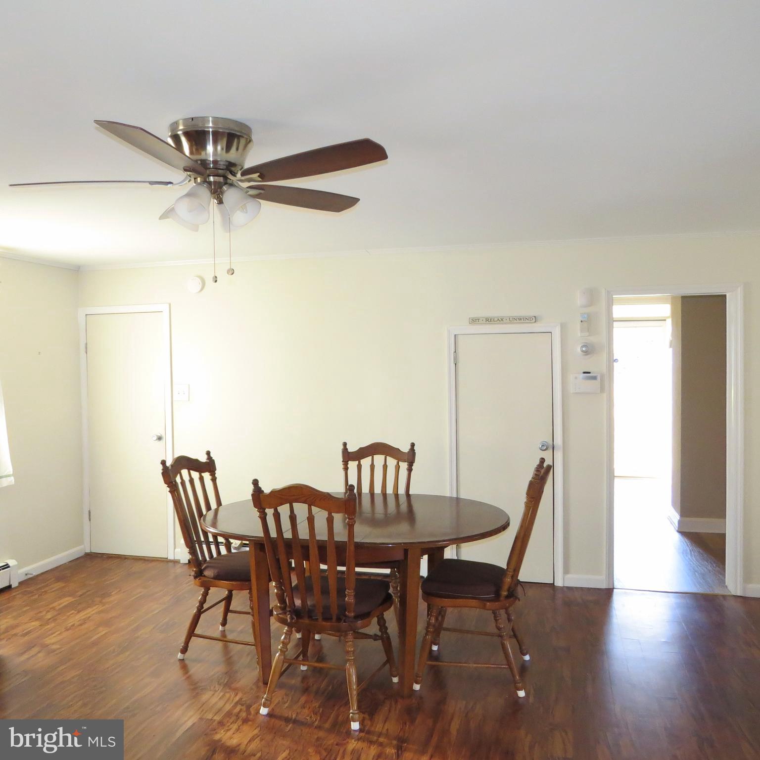 4930 Ridge Road Rosedale, MD 21237 - Photo 12 of 49 a view of a dining room with furniture and wooden floor