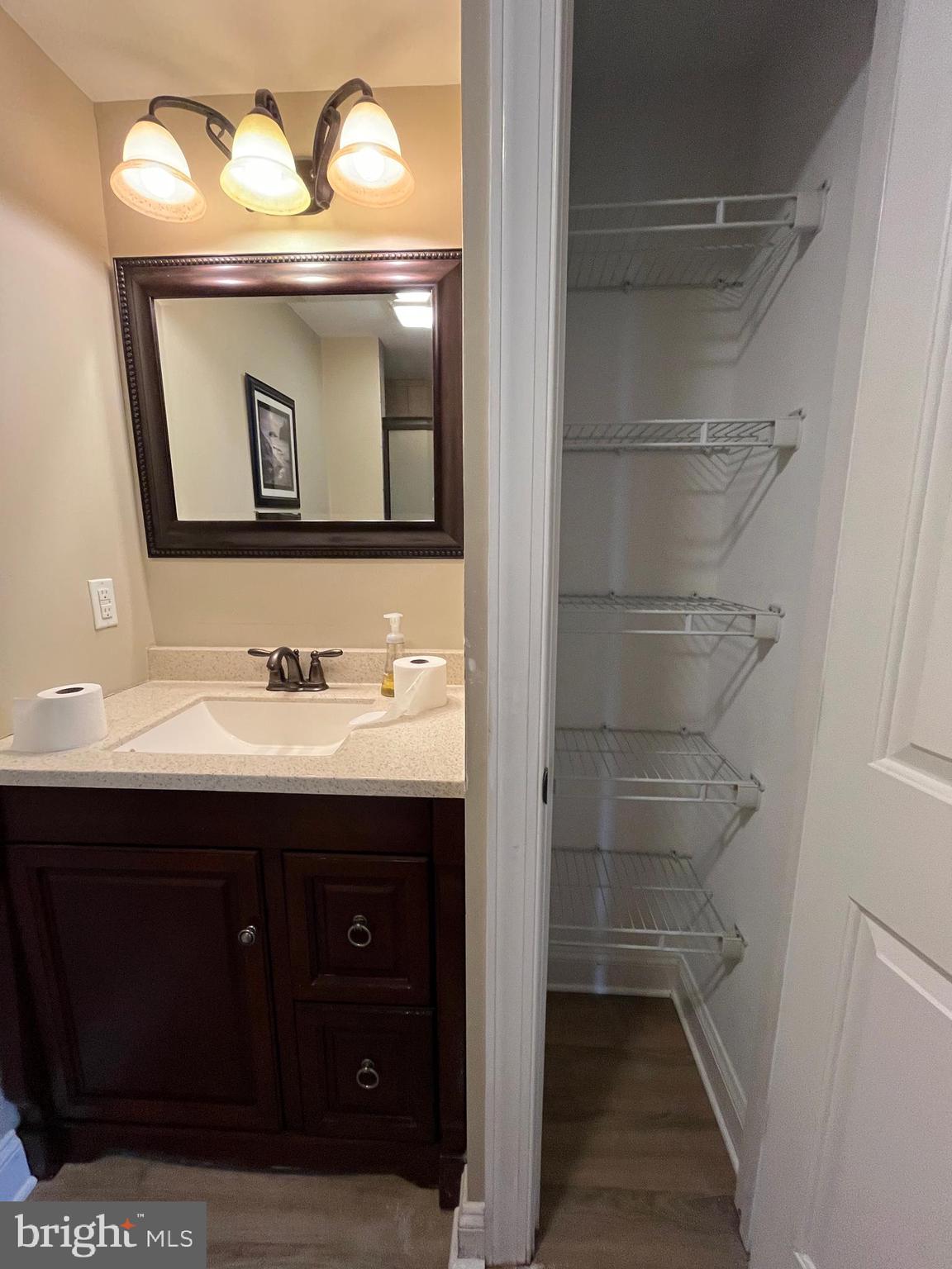 4930 Ridge Road Rosedale, MD 21237 - Photo 15 of 49 a bathroom with a sink vanity and mirror