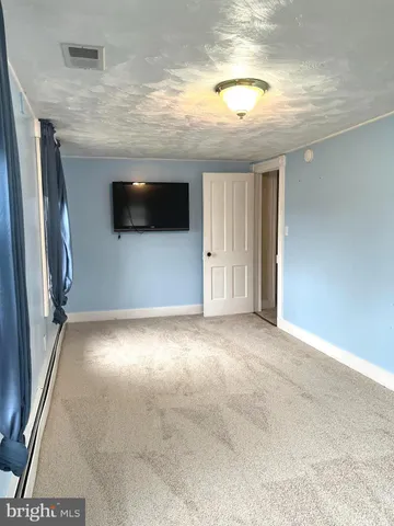 a view of a livingroom with a flat screen tv