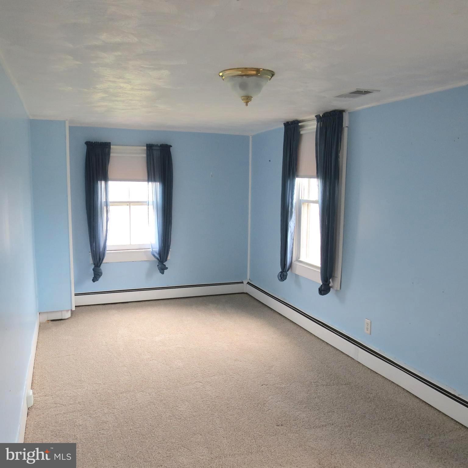 4930 Ridge Road Rosedale, MD 21237 - Photo 20 of 49 an empty room with windows