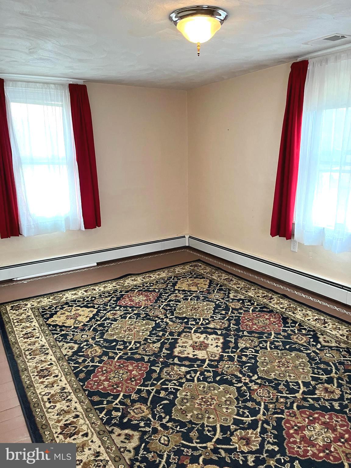 4930 Ridge Road Rosedale, MD 21237 - Photo 21 of 49 a view of a hallway with wooden floor and a large window